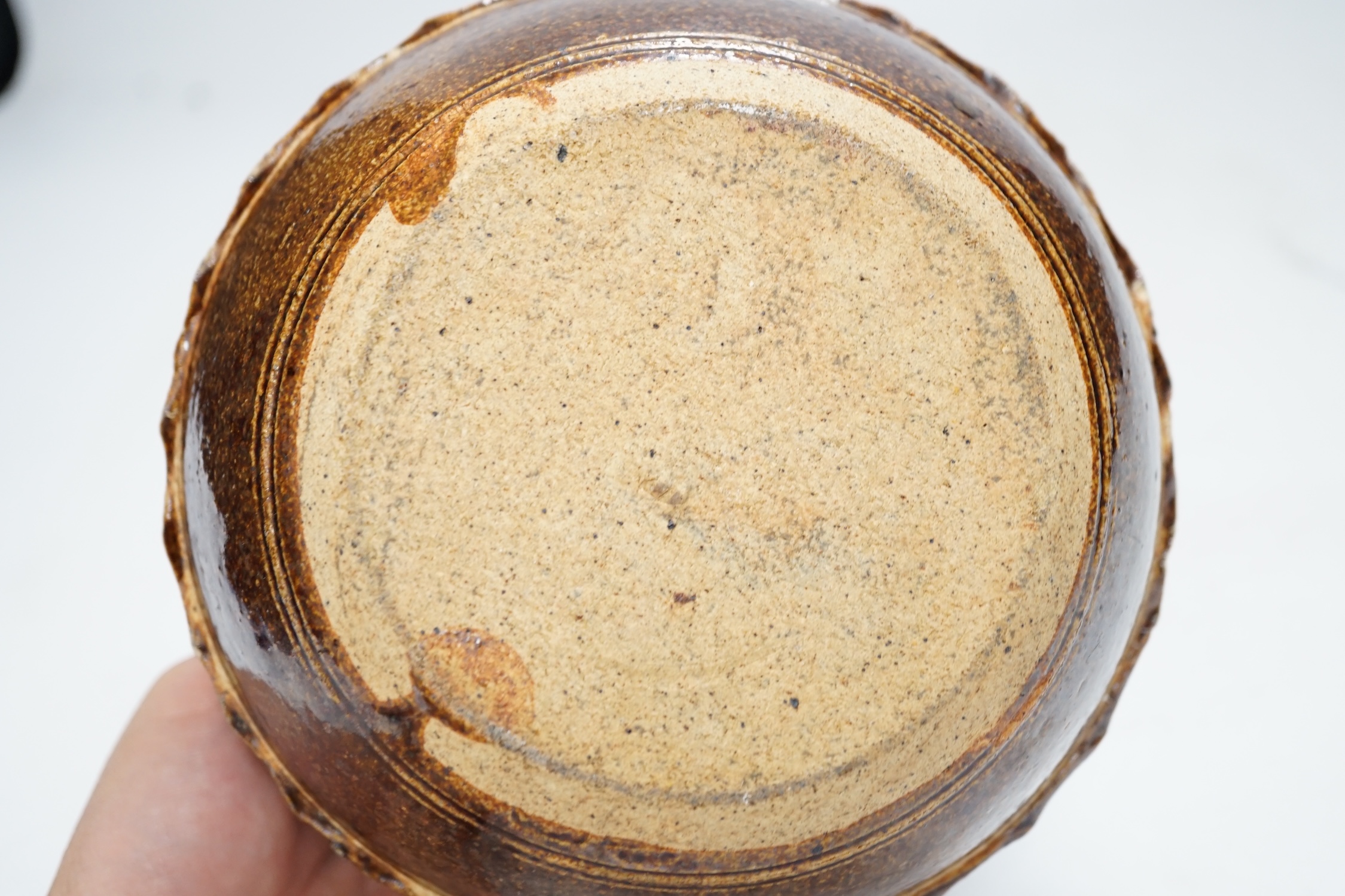 A Wenford Bridge stoneware jar and cover, Gwari, by Michael Cardew, 10cm tall. Condition - fair, cover broken and re-glued